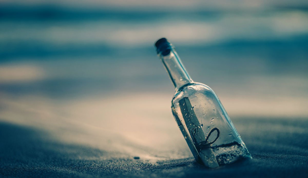 A bottle that has washed up on shore.